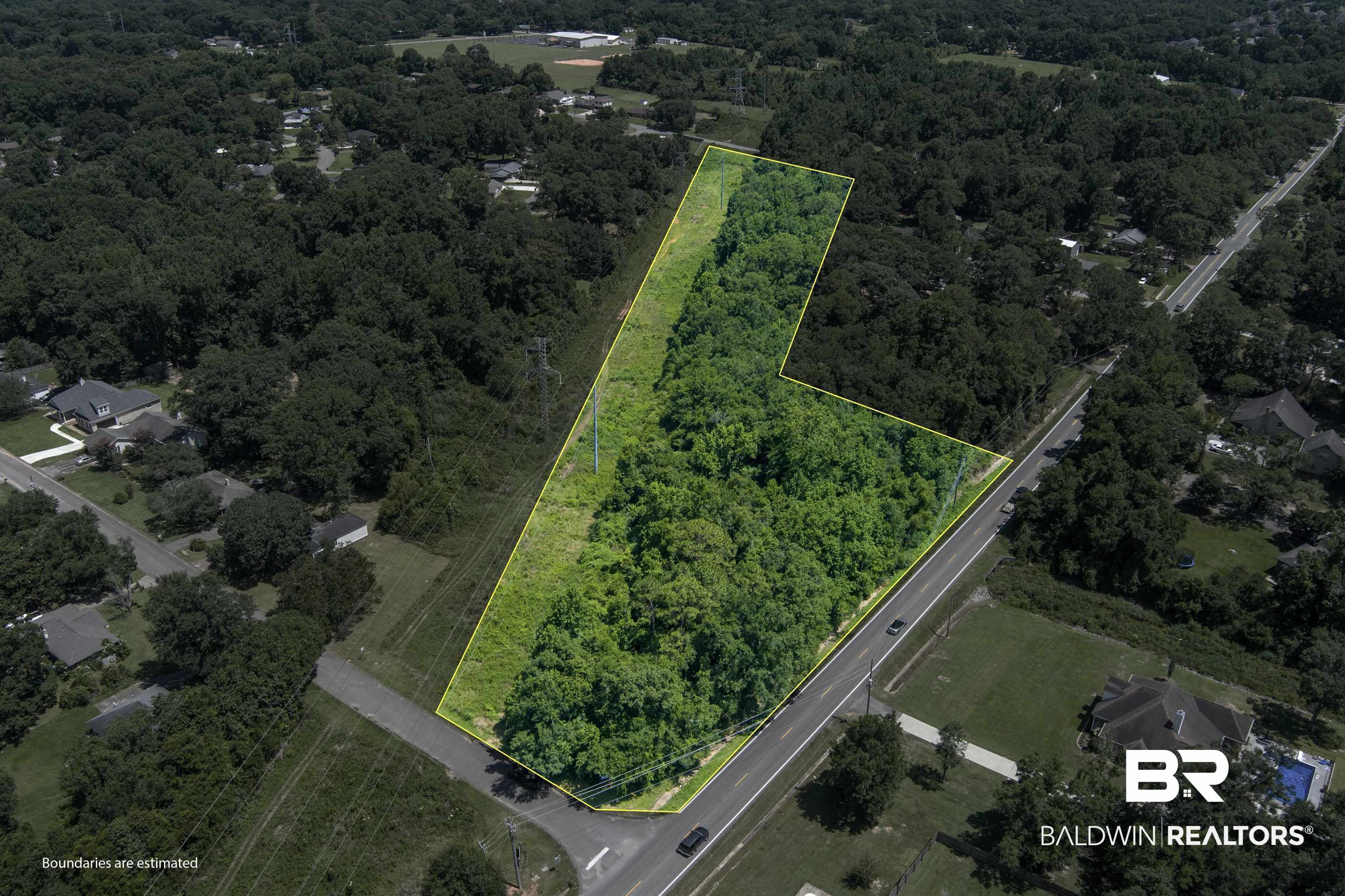 0 McFarland Road Mobile, AL 36695 - Photo 1 of 11 Aerial overview of property's location with property boundaries highlighted and a heavily wooded area
