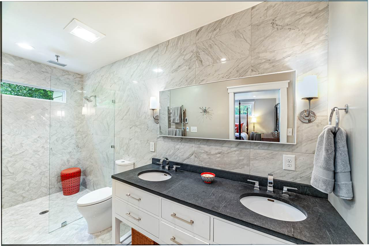 2251 Cranford Road Durham, NC 27705 - Photo 17 of 30 The spa like Master Ensuite bathroom features heated marble flooring, floor to ceiling marble tile, towel warmer, zero entry fixed frameless glass shower screen with ceiling-mount rainfall shower plus double vanity. Master Bedroom Ensuite