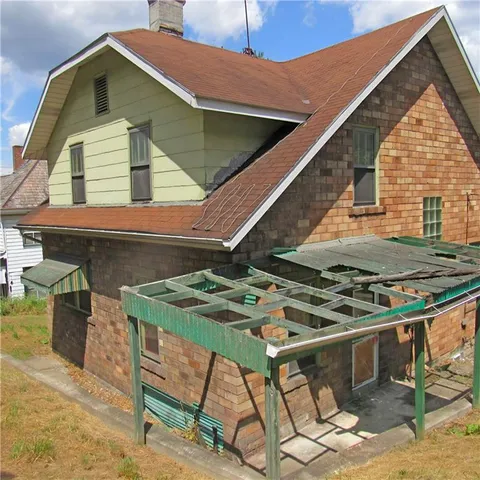 a view of outdoor kitchen outdoor seating and barbeque oven