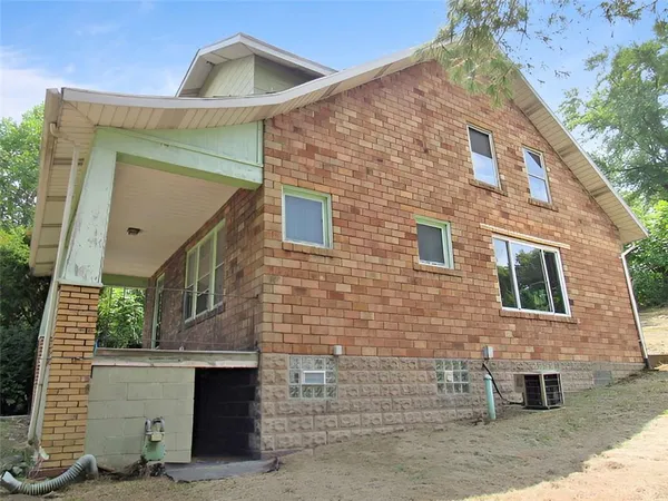 a front view of a house with garage