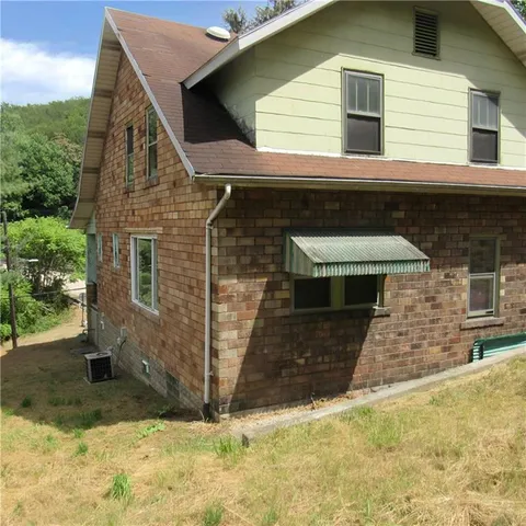 a front view of a house with garage