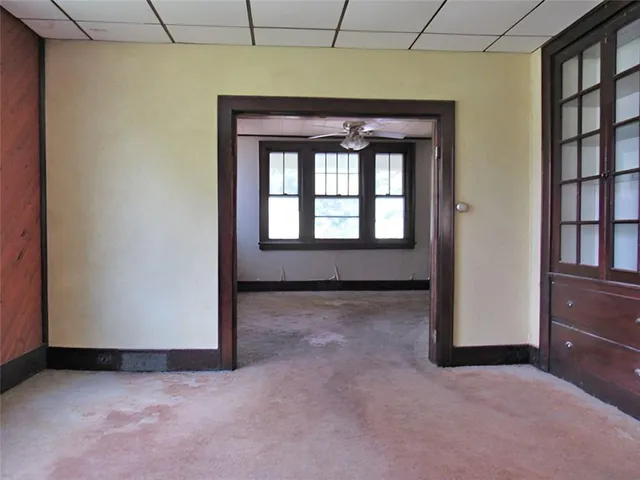 a view of an empty room with a window
