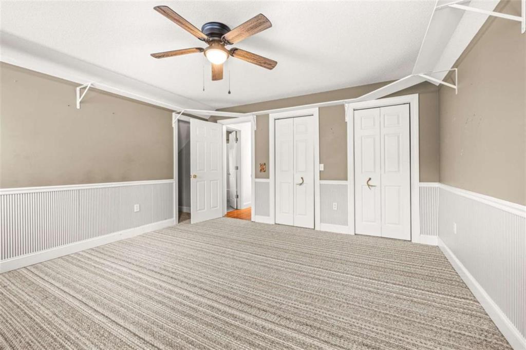 131 Caudell Drive Lula, GA 30554 - Photo 35 of 58 a view of a livingroom with a ceiling fan & wooden floor