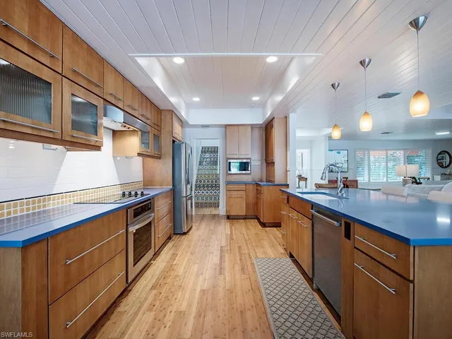 a kitchen with stainless steel appliances granite countertop lots of counter top space