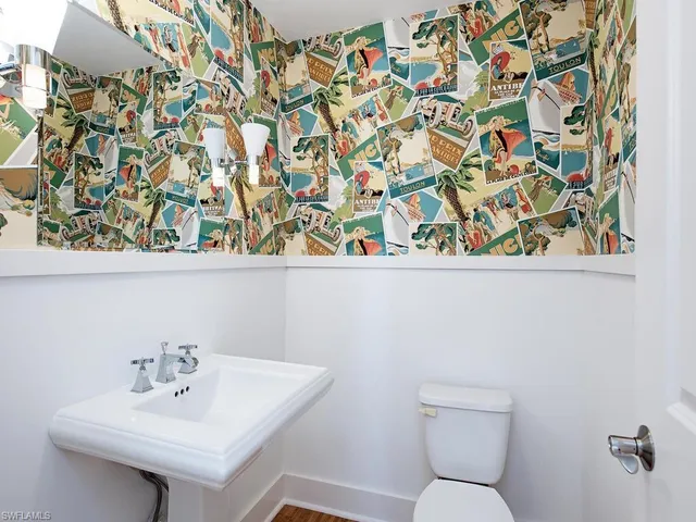 a bathroom with a toilet and a sink