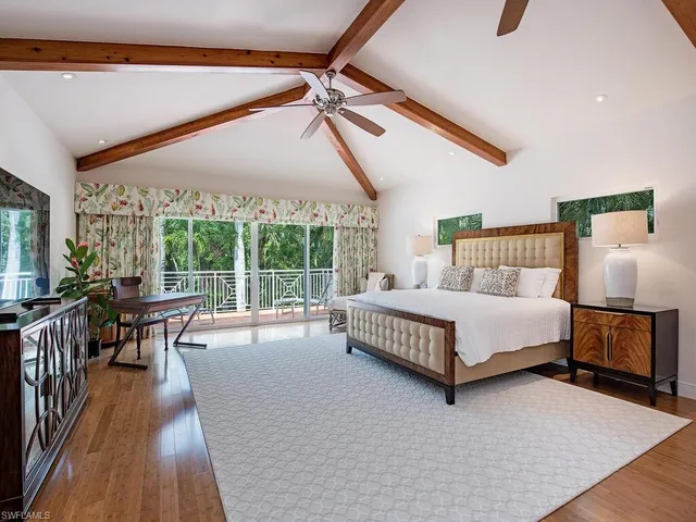 a room with a sink and mirror