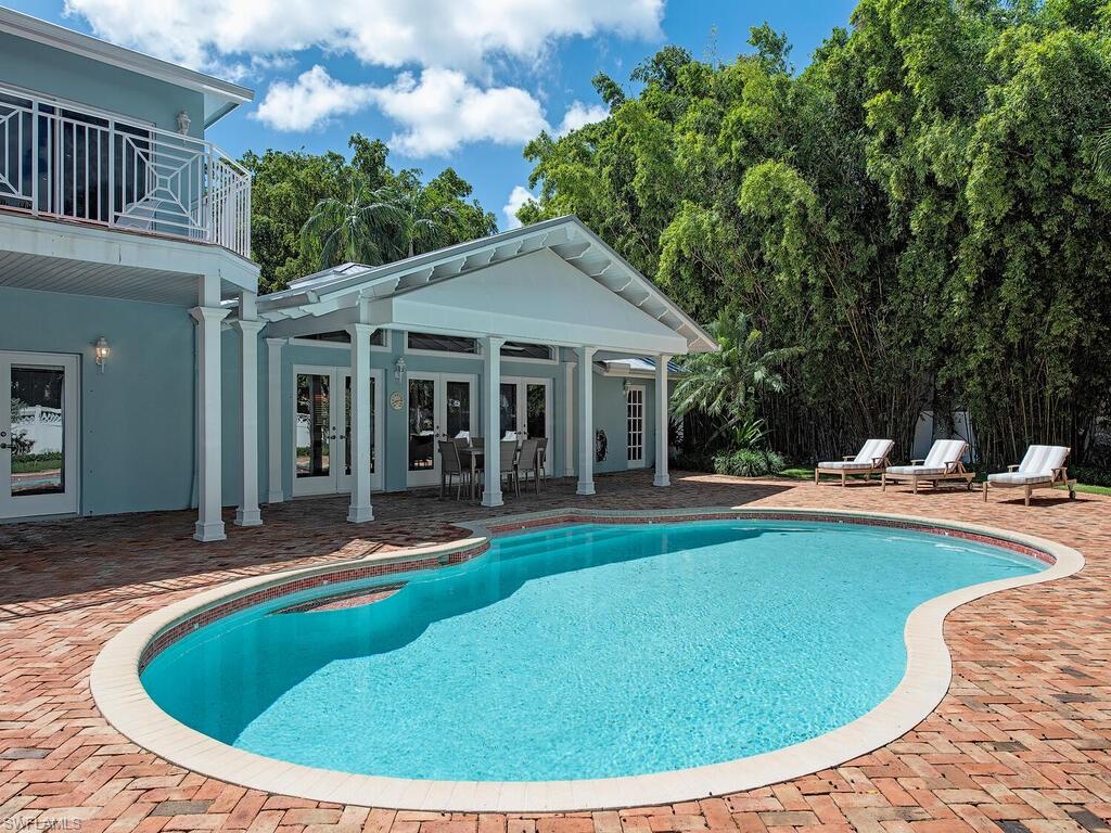 195 2nd Avenue North Naples, FL 34102 - Photo 6 of 26 a view of outdoor space yard swimming pool and patio