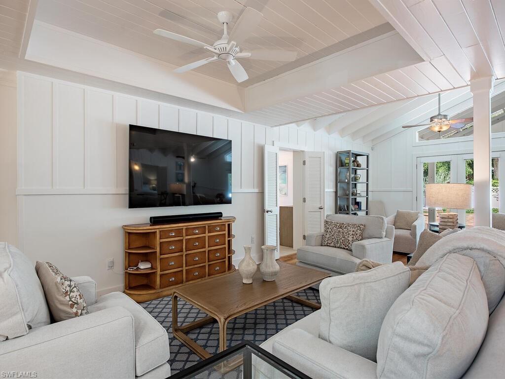195 2nd Avenue North Naples, FL 34102 - Photo 10 of 26 a living room with furniture and a flat screen tv