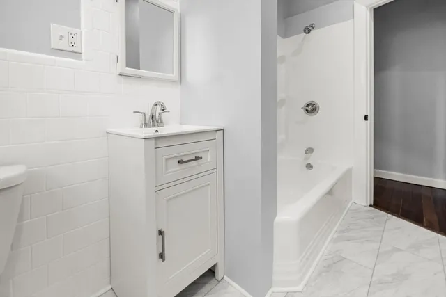 a bathroom with a sink and a tub