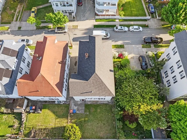 an aerial view of residential houses with outdoor space
