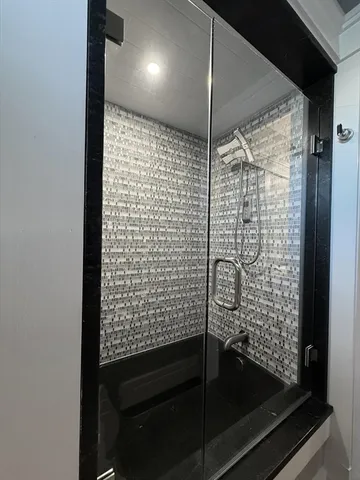 a living room with furniture flat screen tv and a fireplace