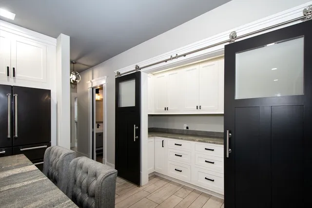 a view of room with window and cabinet