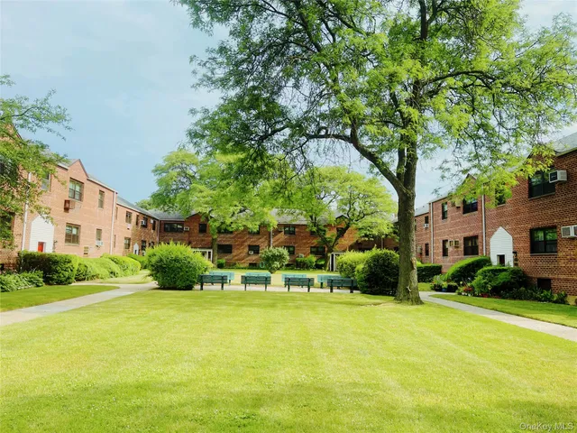 a view of a house with a large trees