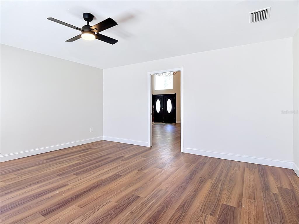 7925 Lake Mabel Loop Road Lake Wales, FL 33898 - Photo 16 of 97 a view of empty room with wooden floor