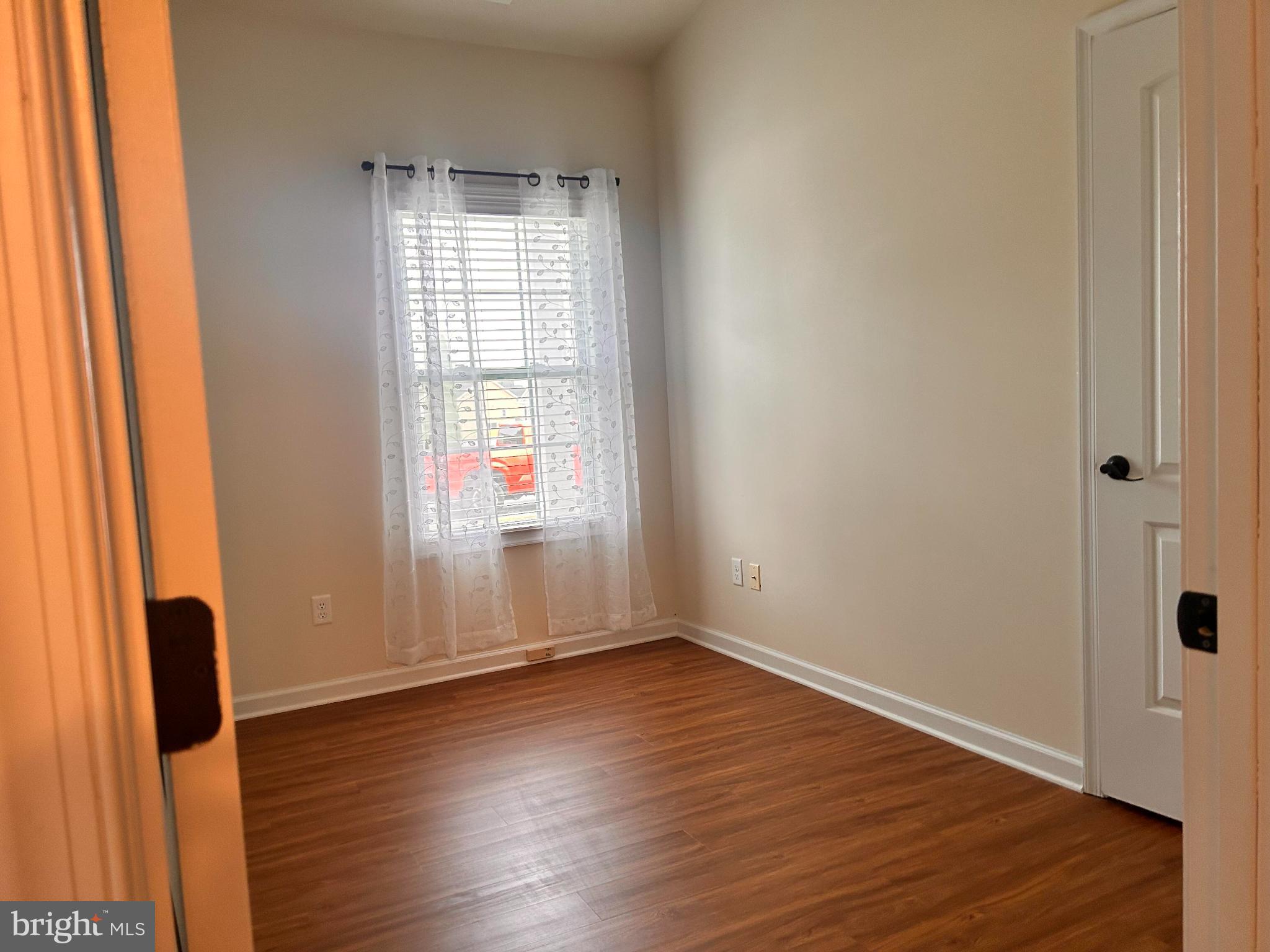 52 Harness Race Road Martinsburg, WV 25404 - Photo 8 of 16 an empty room with wooden floor and windows