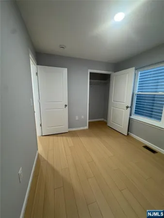 a view of an empty room with a fireplace