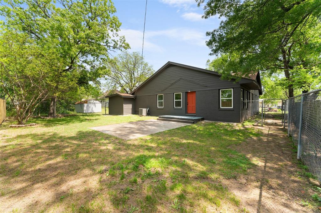 2405 Monroe Street Commerce, TX 75428 - Photo 28 of 31 a front view of house with yard and green space