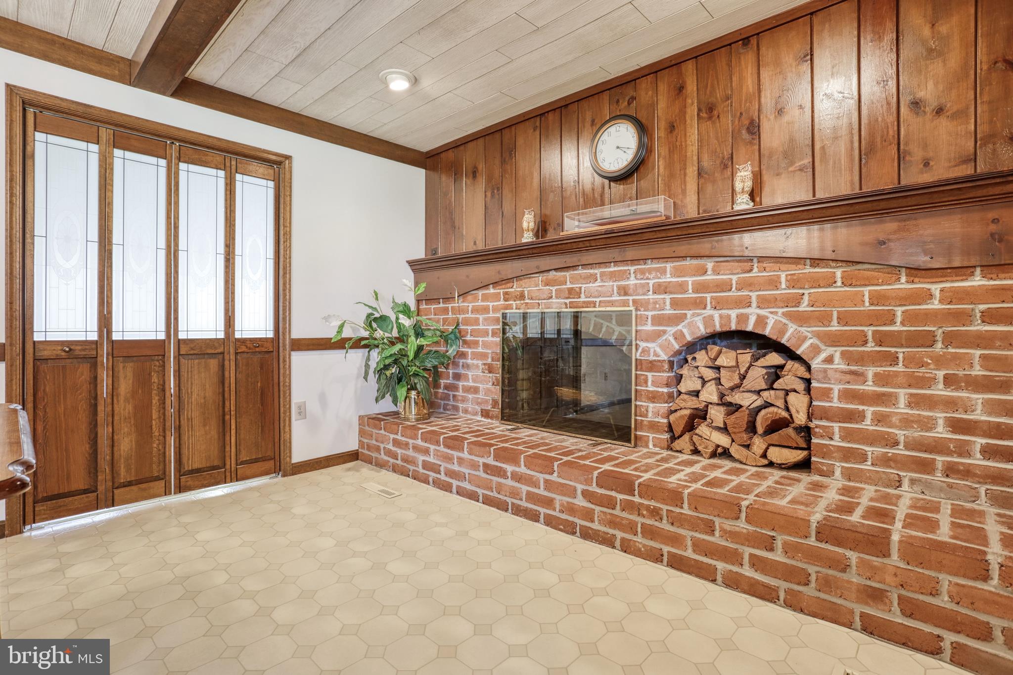 110 Singer Road New Freedom, PA 17349 - Photo 14 of 79 Wood fireplace. Doors to separate living room.
