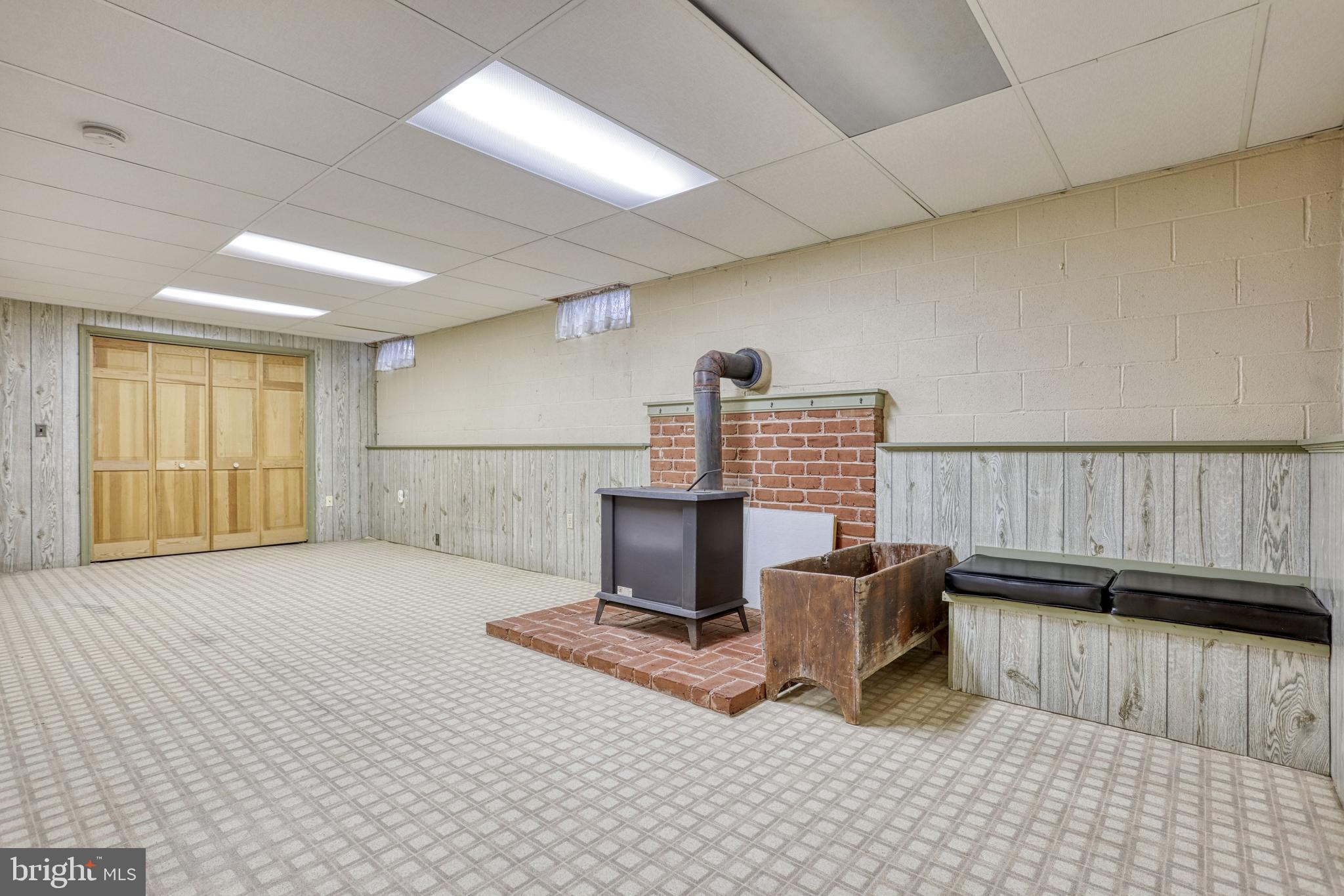 110 Singer Road New Freedom, PA 17349 - Photo 38 of 79 Basement family room with wood stove
