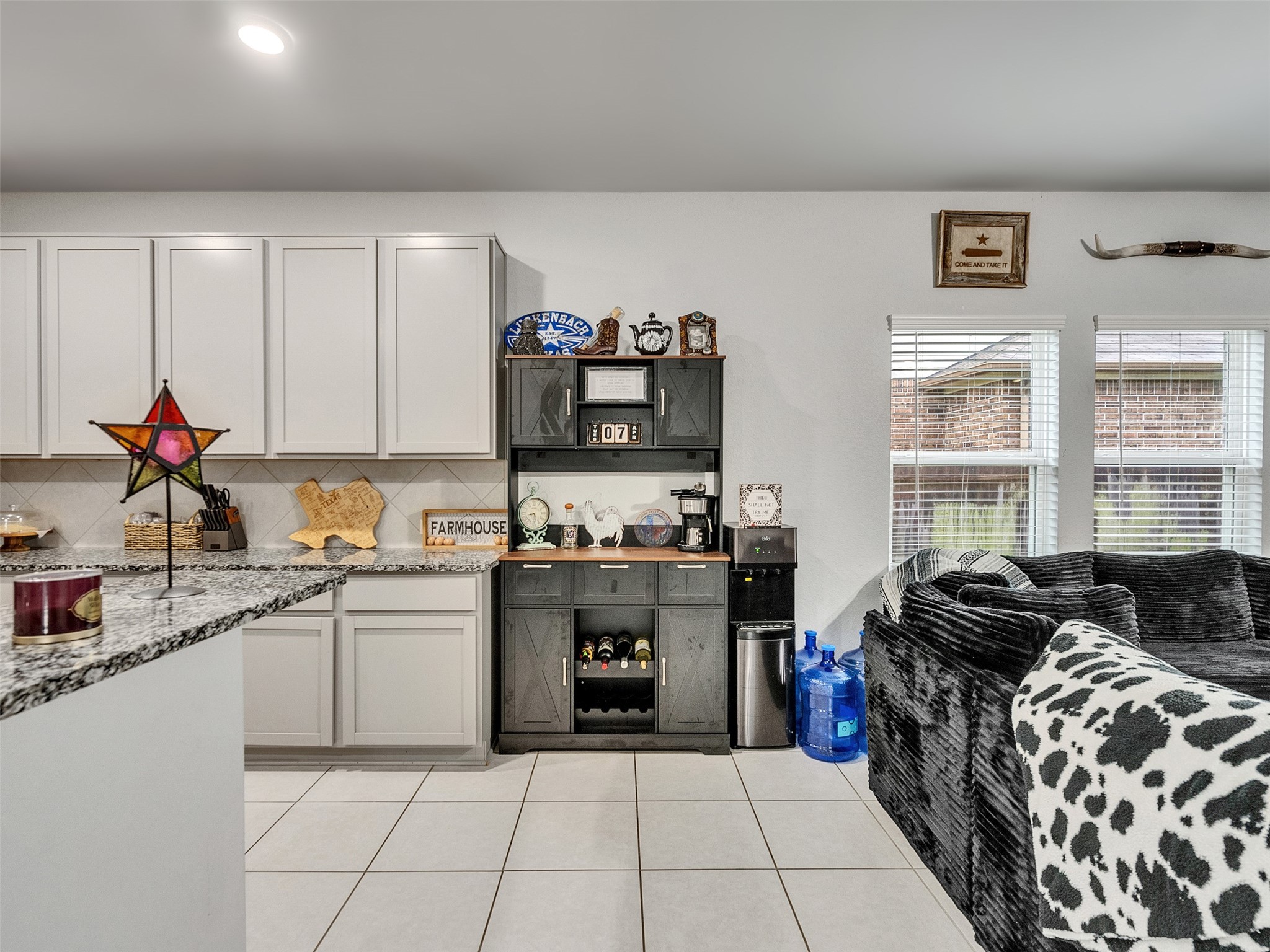 8719 Willet Street Baytown, TX 77521 - Photo 14 of 42 a kitchen with stainless steel appliances granite countertop a stove and a sink