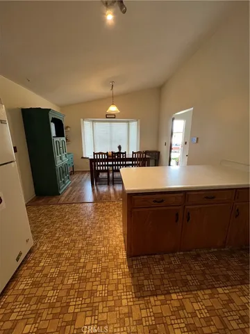 a large kitchen with lots of counter space and a sink