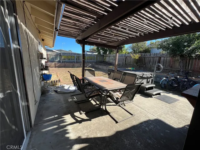 a patio with table and chairs