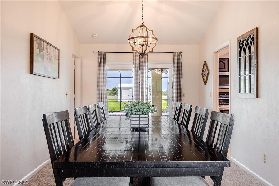 1367 Frontier Circle LaBelle, FL 33935 - Photo 12 of 37 a view of a dining room with furniture window and wooden floor