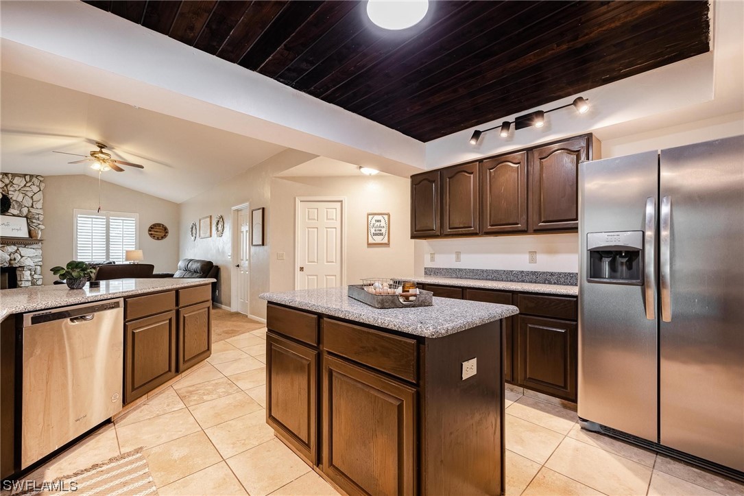 1367 Frontier Circle LaBelle, FL 33935 - Photo 14 of 37 a kitchen with stainless steel appliances granite countertop a sink stove and refrigerator