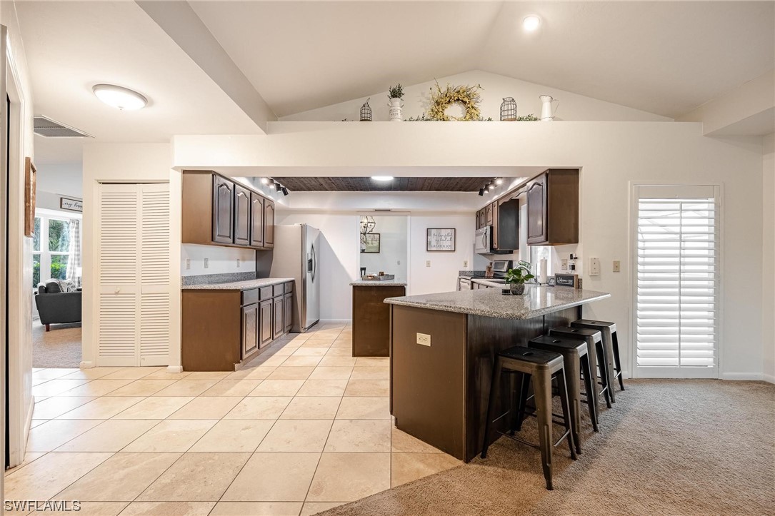 1367 Frontier Circle LaBelle, FL 33935 - Photo 17 of 37 a kitchen with stainless steel appliances granite countertop a sink and cabinets