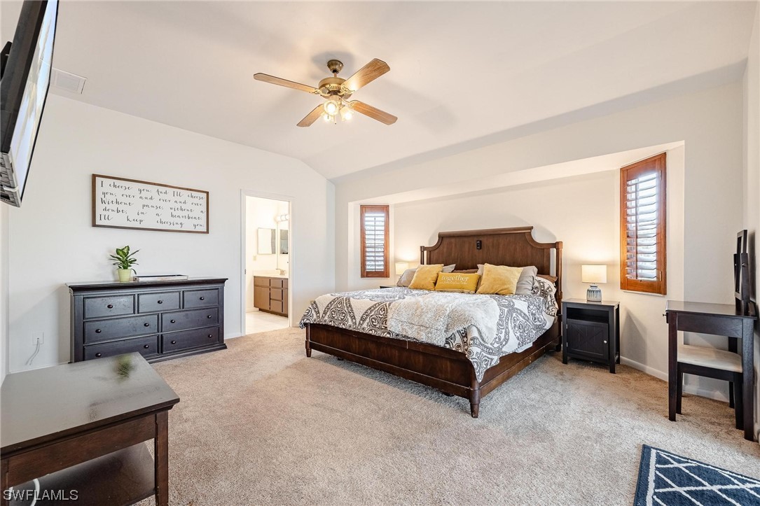 1367 Frontier Circle LaBelle, FL 33935 - Photo 18 of 37 a spacious bedroom with a bed and a table in it