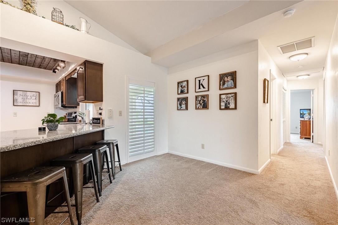 1367 Frontier Circle LaBelle, FL 33935 - Photo 22 of 37 a view of a kitchen cabinets and dining room