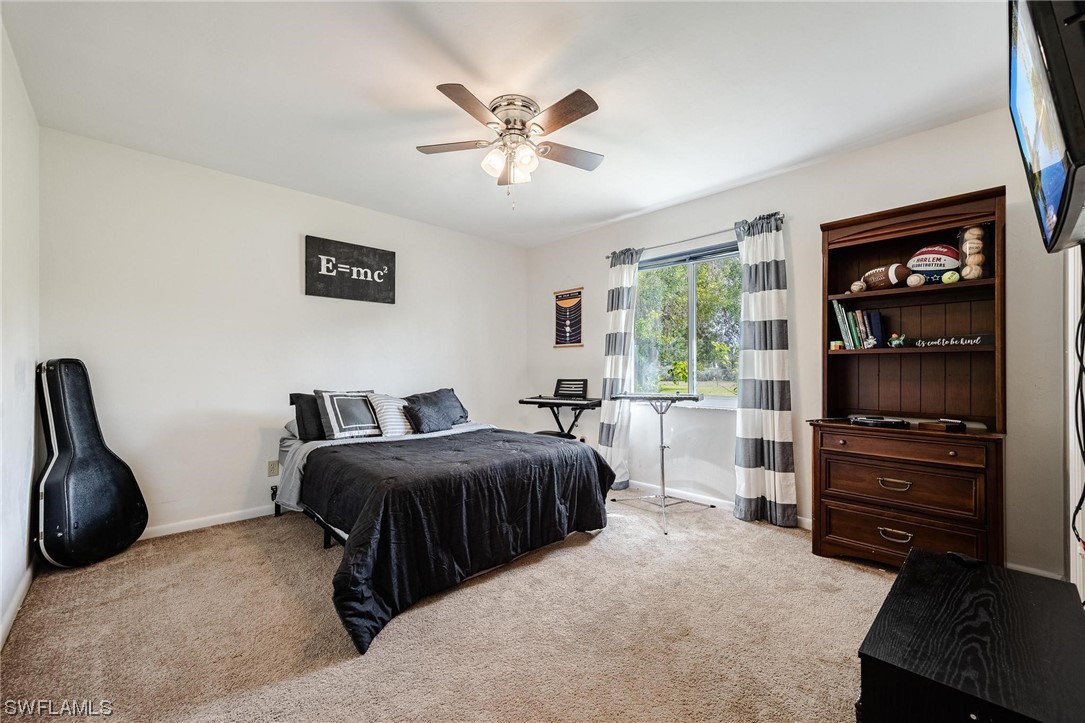 1367 Frontier Circle LaBelle, FL 33935 - Photo 24 of 37 a bedroom with a bed furniture and a window