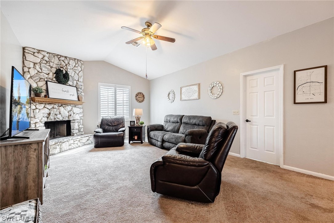 1367 Frontier Circle LaBelle, FL 33935 - Photo 3 of 37 a living room with furniture and a fireplace