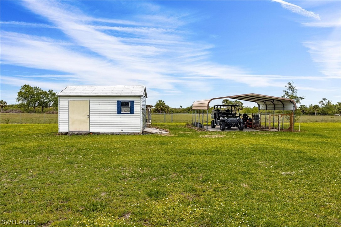 1367 Frontier Circle LaBelle, FL 33935 - Photo 32 of 37 a view of a house with a big yard