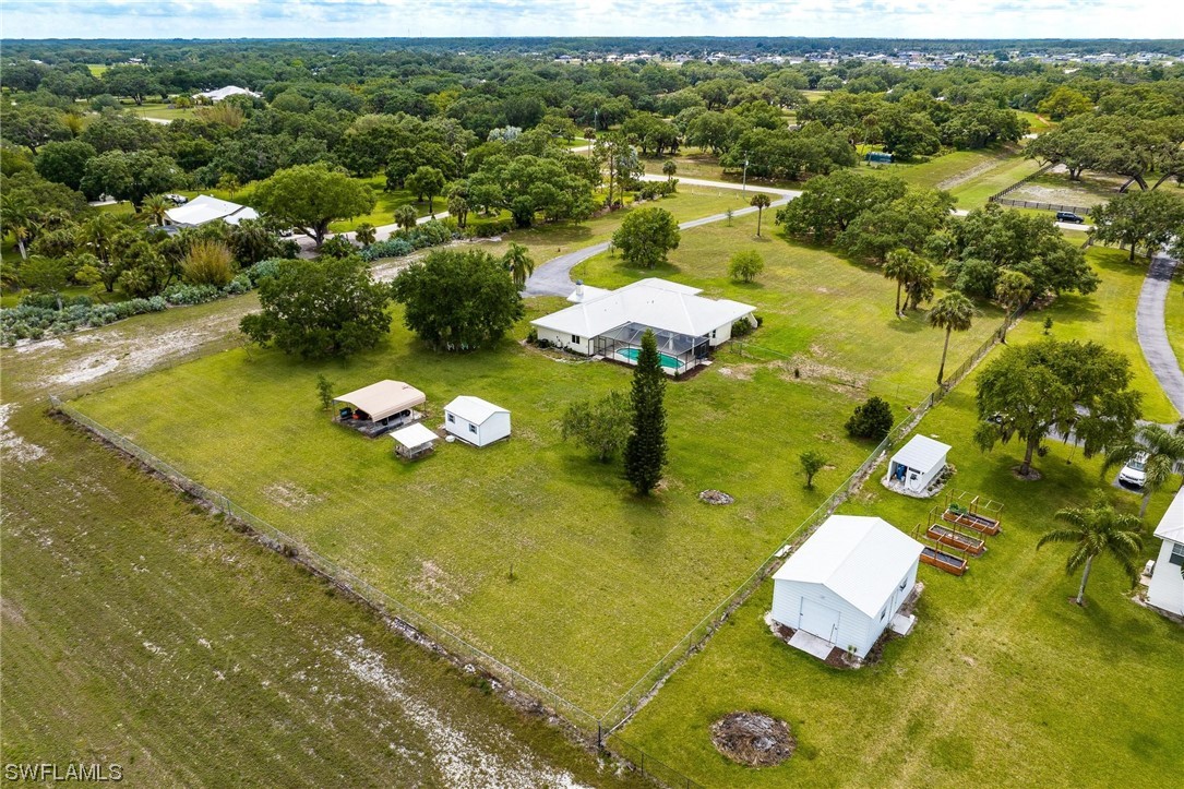 1367 Frontier Circle LaBelle, FL 33935 - Photo 35 of 37 a aerial view of a residential houses with swimming pool