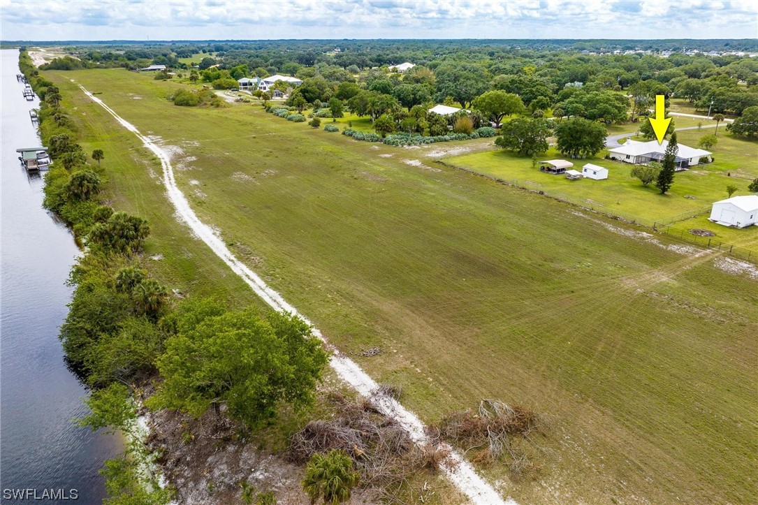 1367 Frontier Circle LaBelle, FL 33935 - Photo 36 of 37 a view of a lake with houses
