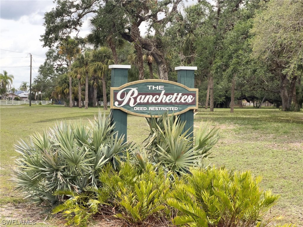 1367 Frontier Circle LaBelle, FL 33935 - Photo 37 of 37 a sign that is on a big yard with plants