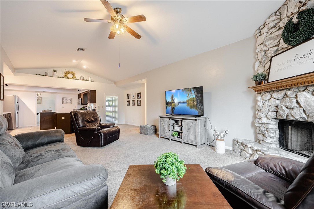 1367 Frontier Circle LaBelle, FL 33935 - Photo 5 of 37 a living room with furniture and a fireplace