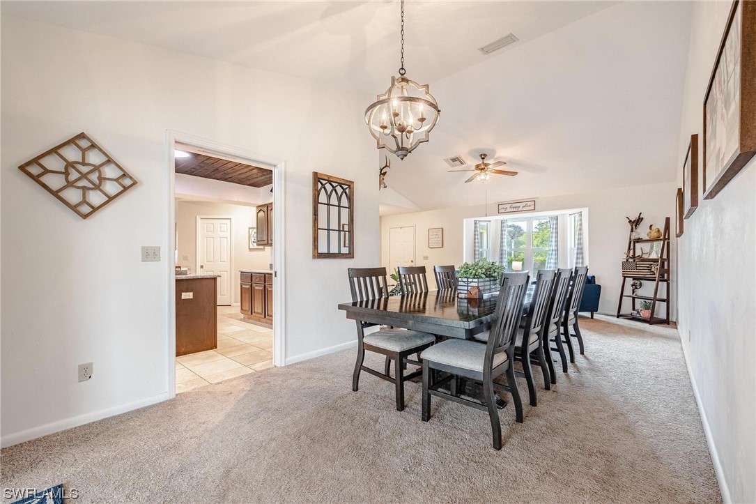 1367 Frontier Circle LaBelle, FL 33935 - Photo 8 of 37 a view of a dining room with furniture window and wooden floor