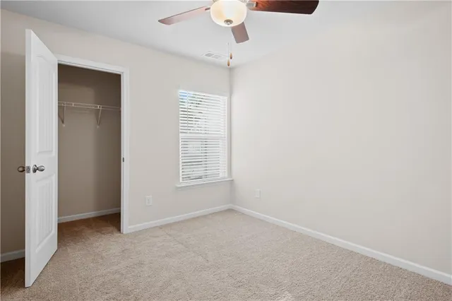 an empty room with a empty space and windows