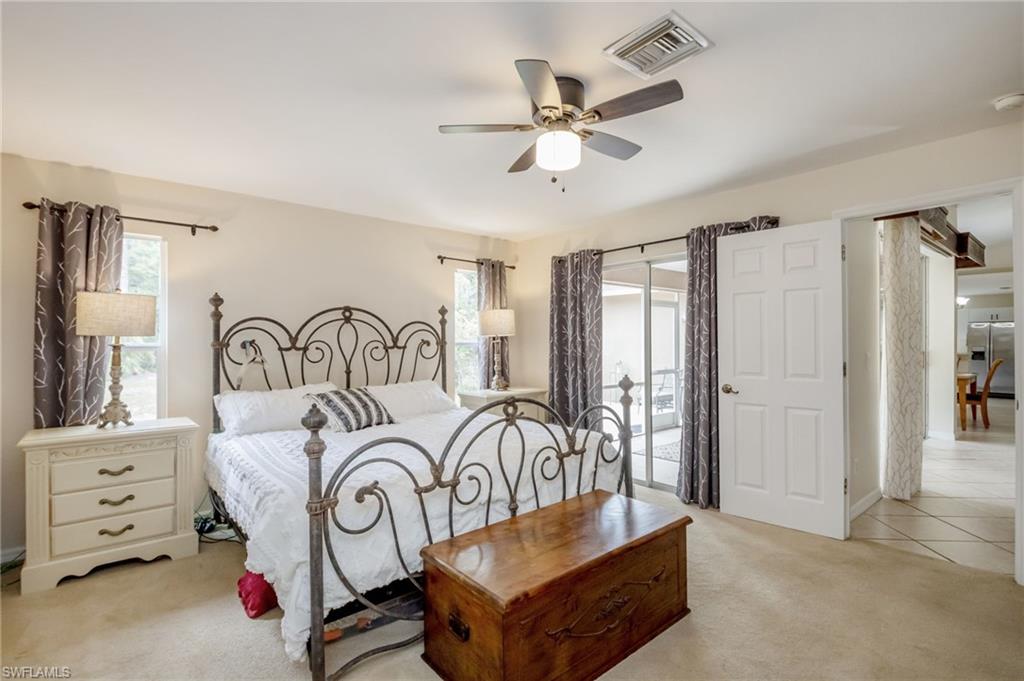 2910 2nd Street Northeast Naples, FL 34120 - Photo 19 of 36 a living room with furniture and a window
