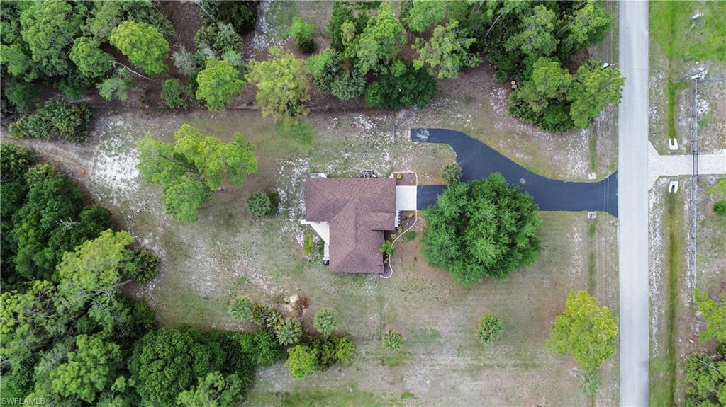 2910 2nd Street Northeast Naples, FL 34120 - Photo 2 of 36 an aerial view of a house with a yard and lake view