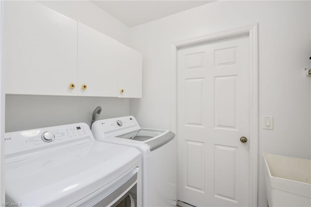 2910 2nd Street Northeast Naples, FL 34120 - Photo 23 of 36 a utility room with dryer and washer