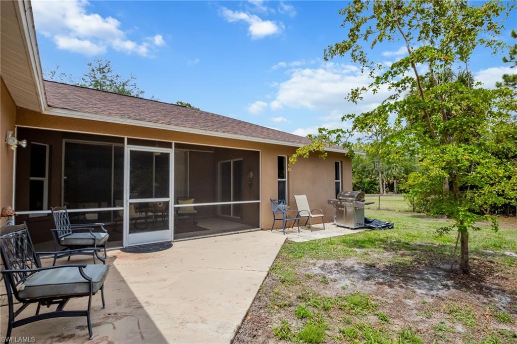 2910 2nd Street Northeast Naples, FL 34120 - Photo 26 of 36 a house view with a sitting space and garden