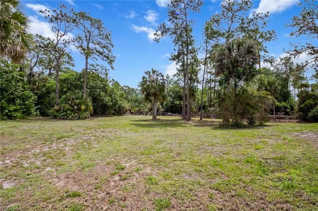 2910 2nd Street Northeast Naples, FL 34120 - Photo 27 of 36 a view of outdoor space with deck and yard