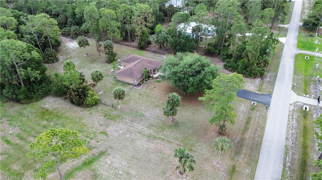 2910 2nd Street Northeast Naples, FL 34120 - Photo 31 of 36 an aerial view of a house with a yard