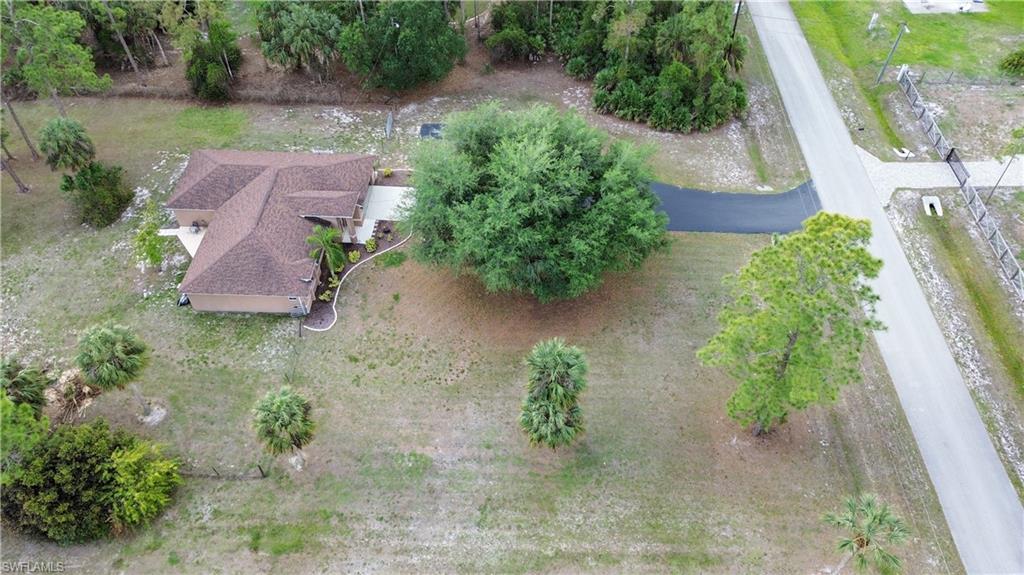 2910 2nd Street Northeast Naples, FL 34120 - Photo 32 of 36 an aerial view of a house with garden space and a street view