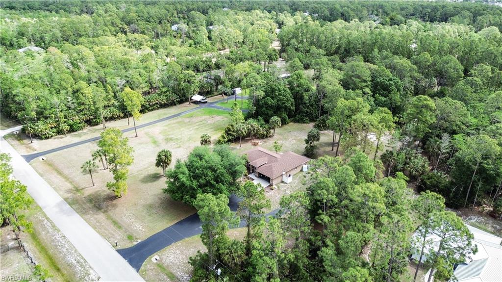 2910 2nd Street Northeast Naples, FL 34120 - Photo 35 of 36 an aerial view of a house with a yard