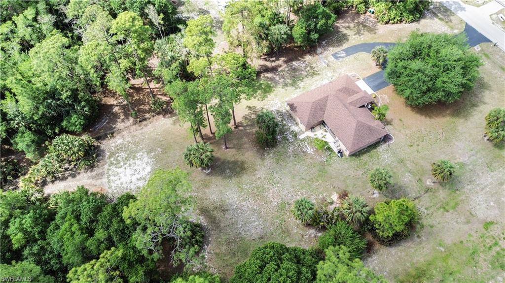 2910 2nd Street Northeast Naples, FL 34120 - Photo 36 of 36 an aerial view of a house with a yard