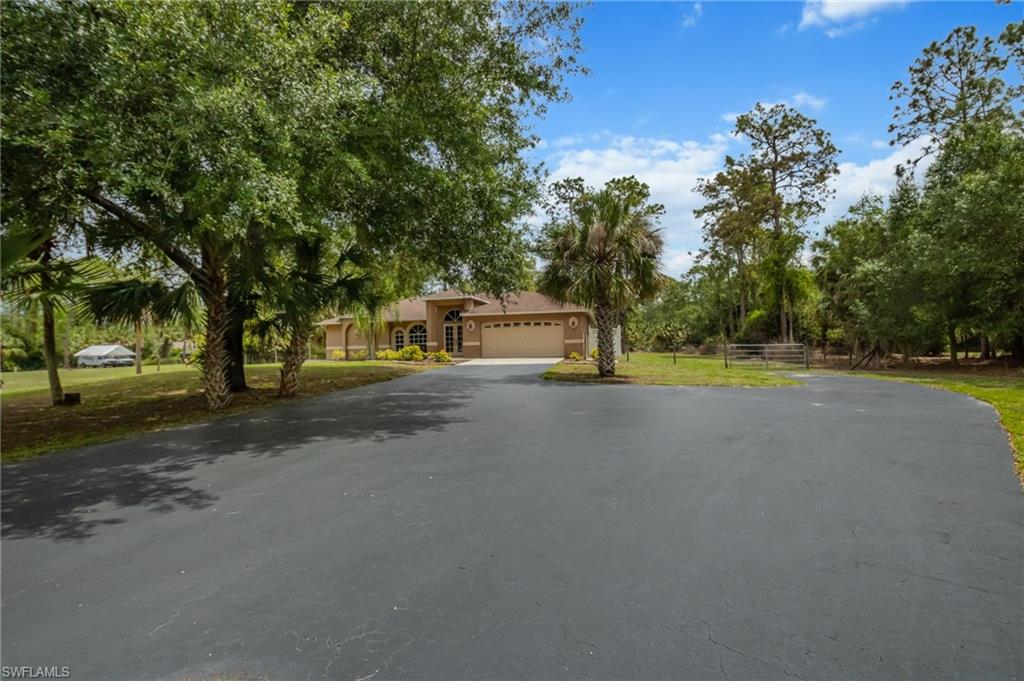 2910 2nd Street Northeast Naples, FL 34120 - Photo 4 of 36 a view of a house with a street